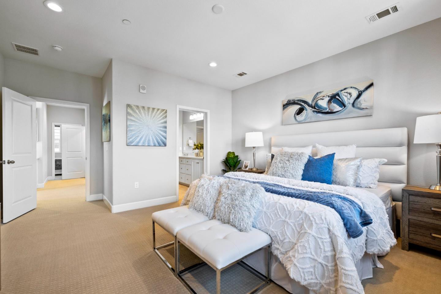 123 Lemmon Terrace Sunnyvale, CA 94086 - Photo 19 of 42 a spacious bedroom with a bed and a couch