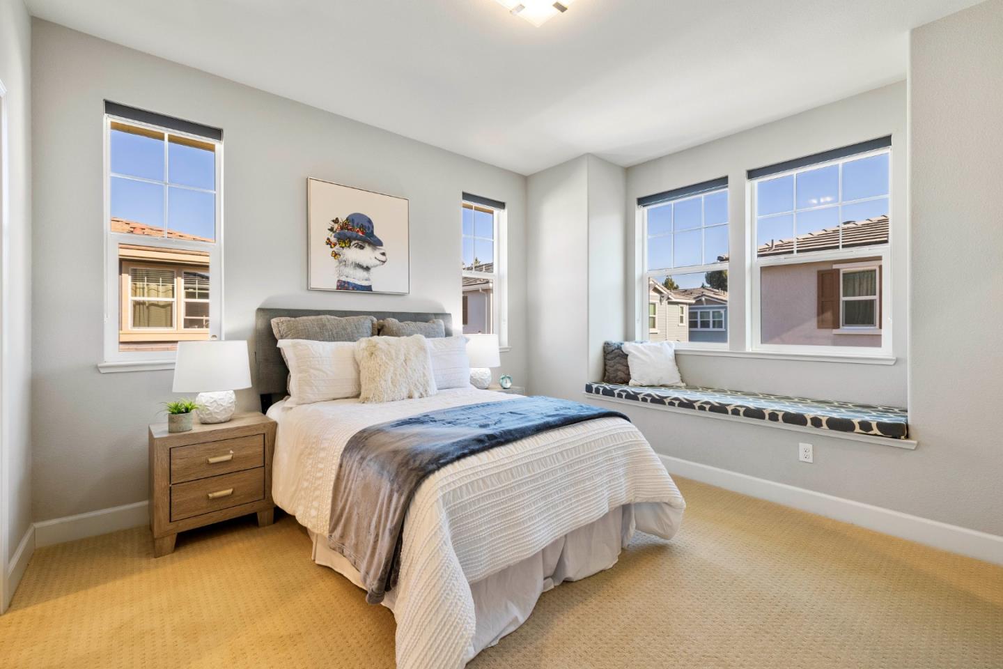123 Lemmon Terrace Sunnyvale, CA 94086 - Photo 23 of 42 a spacious bedroom with a bed and a window