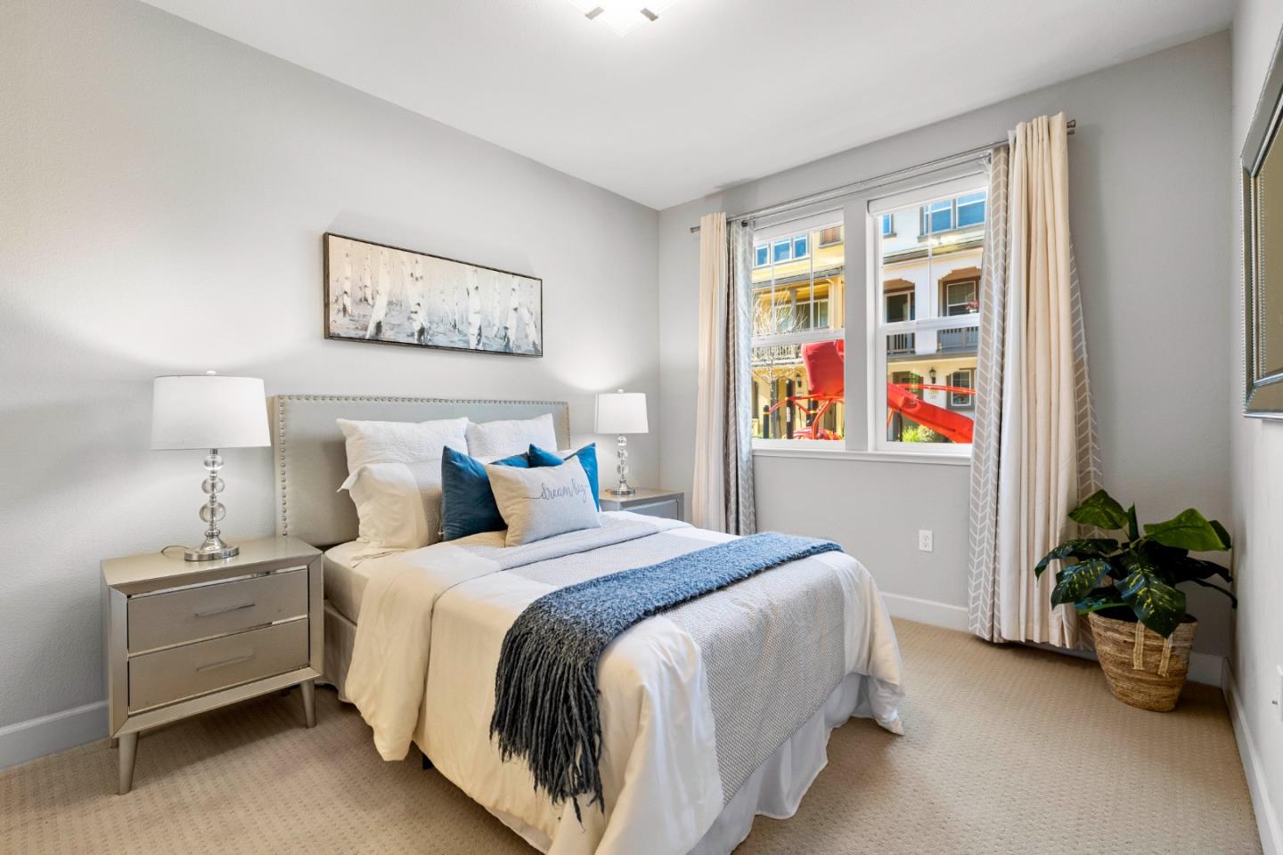 123 Lemmon Terrace Sunnyvale, CA 94086 - Photo 26 of 42 a bedroom with a bed and a painting on the wall