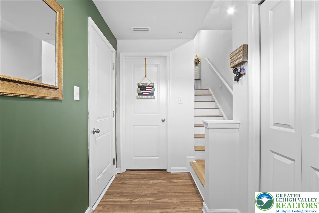 2336 Alex Road Easton, PA 18040 - Photo 20 of 35 Rich hardwood floors welcome you to a central hallway with convenient interior access to essential living spaces.