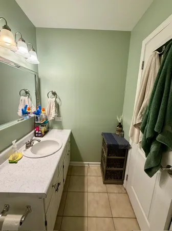 a white toilet sitting next to a bath tub