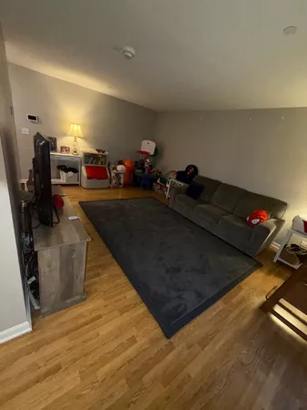 a room with gym equipment and a flat screen tv