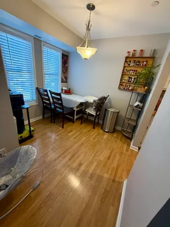 a kitchen with sink a stove and cabinets