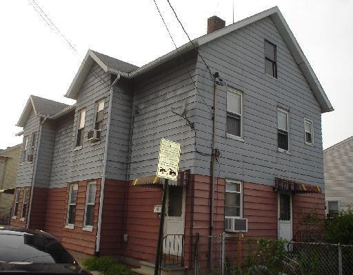 57 Sherman Street Bridgeport, CT 06608 - Photo 1 of 1 a view of a house with brick walls and stairs