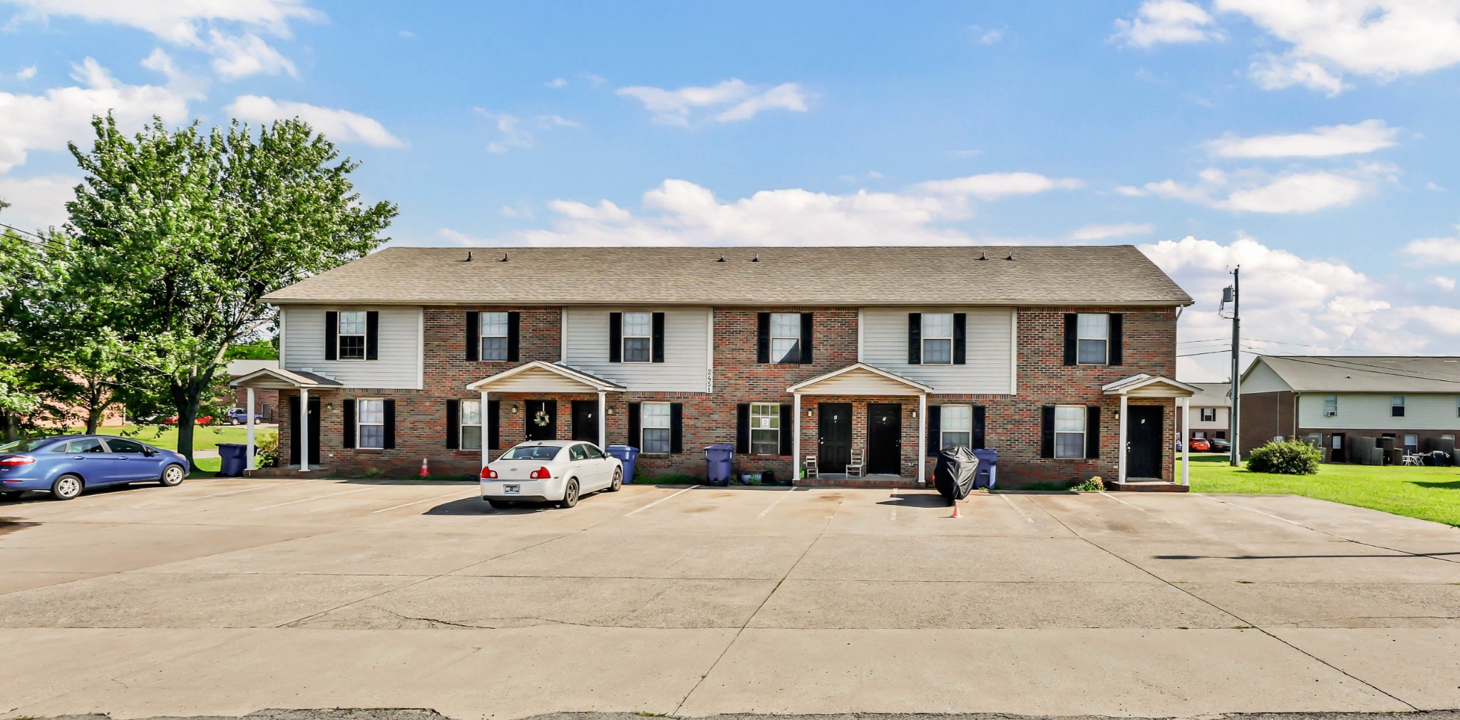 2451 Wilson Road, Unit 6 Clarksville, TN 37043 - Photo 19 of 21 a front view of a residential apartment building with a yard