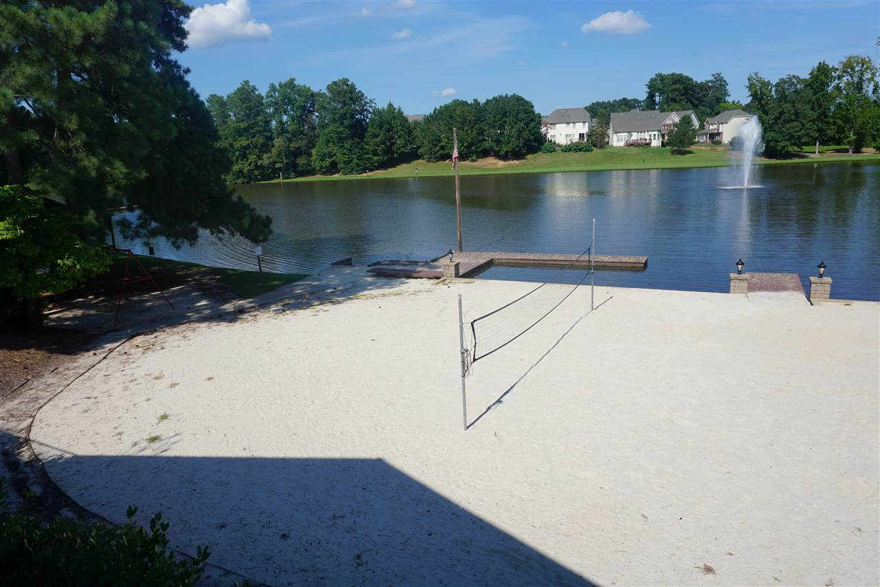 2411 Memory Ridge Drive Raleigh, NC 27606 - Photo 23 of 25 Short walk to community pond with walking trial, volleyball court, dock, swingsets and pavilion.