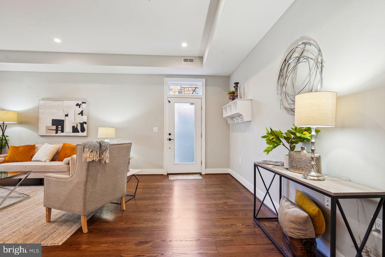 1401 K Street Southeast, Unit 1 Washington, DC 20003 - Photo 11 of 48 a living room with furniture and a wooden floor