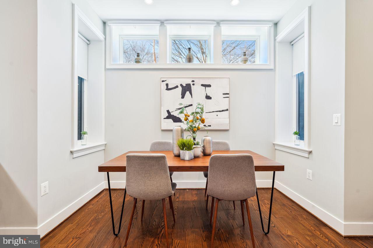 1401 K Street Southeast, Unit 1 Washington, DC 20003 - Photo 19 of 48 a dining room with furniture and wooden floor