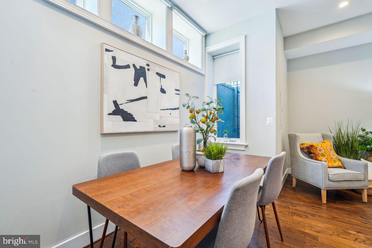 1401 K Street Southeast, Unit 1 Washington, DC 20003 - Photo 20 of 48 a view of a dining room with furniture and wooden floor