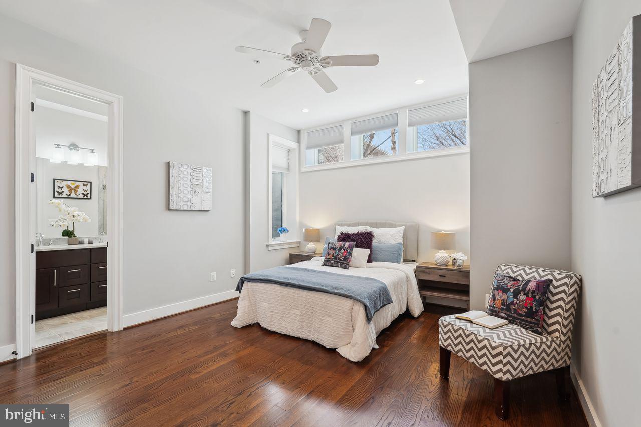 1401 K Street Southeast, Unit 1 Washington, DC 20003 - Photo 23 of 48 a bedroom with a bed furniture and wooden floor