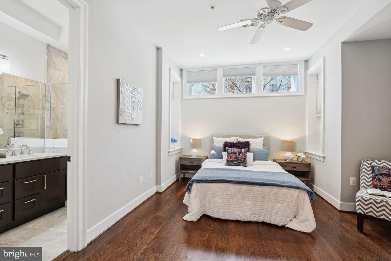 1401 K Street Southeast, Unit 1 Washington, DC 20003 - Photo 25 of 48 a bedroom with a bed and wooden floor