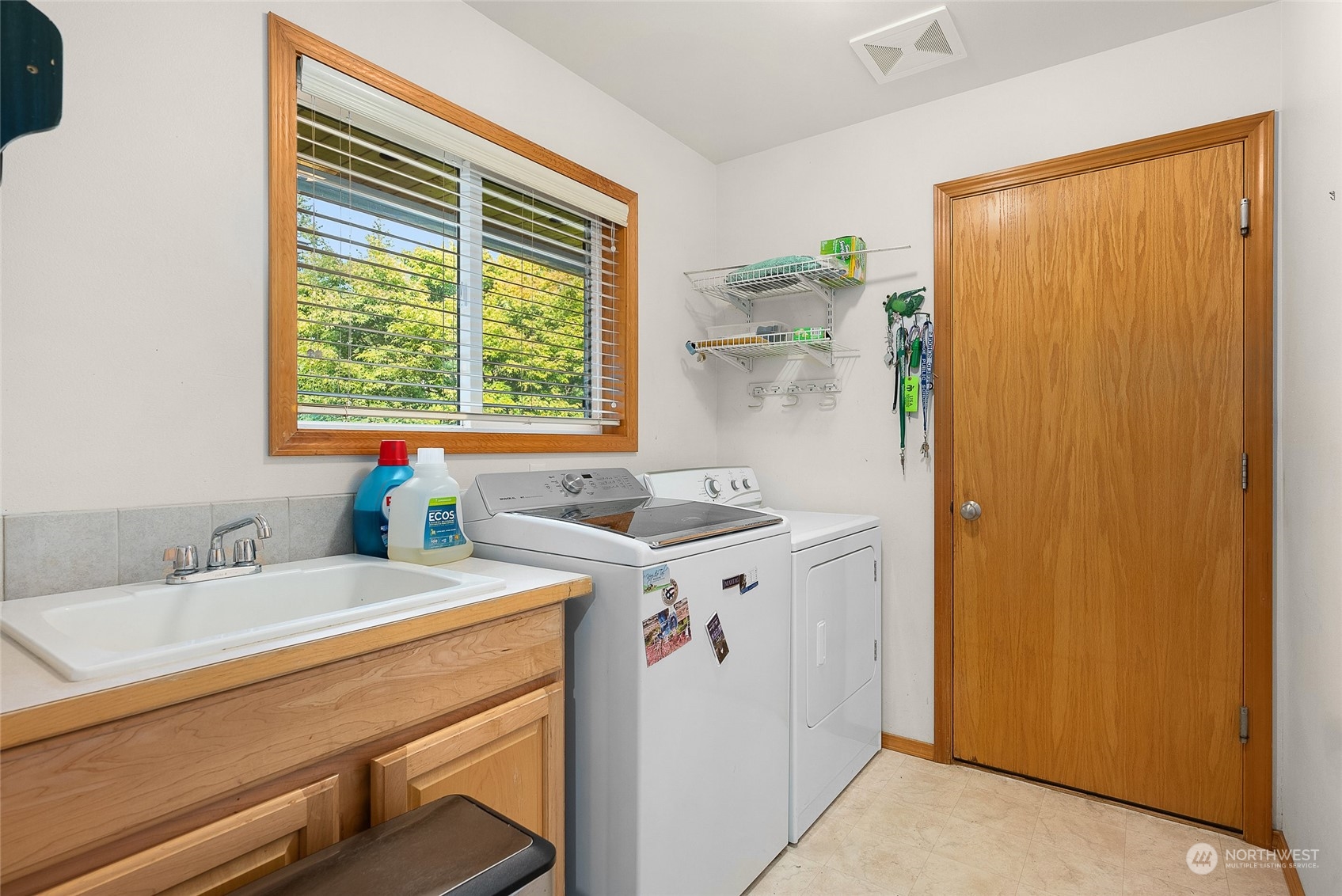 17310 Freestad Road Arlington, WA 98223 - Photo 14 of 29 a bathroom with a granite countertop sink and a window