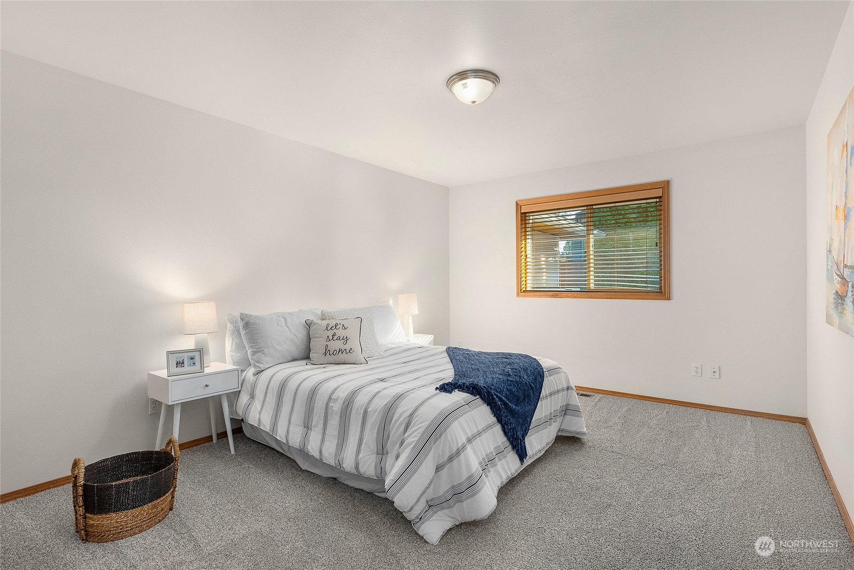 17310 Freestad Road Arlington, WA 98223 - Photo 15 of 29 a bedroom with a bed and painting on the wall