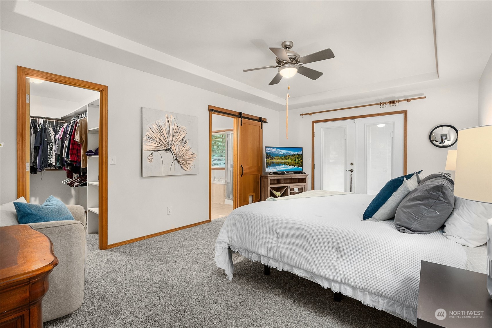 17310 Freestad Road Arlington, WA 98223 - Photo 17 of 29 a bedroom with a bed and ceiling fan