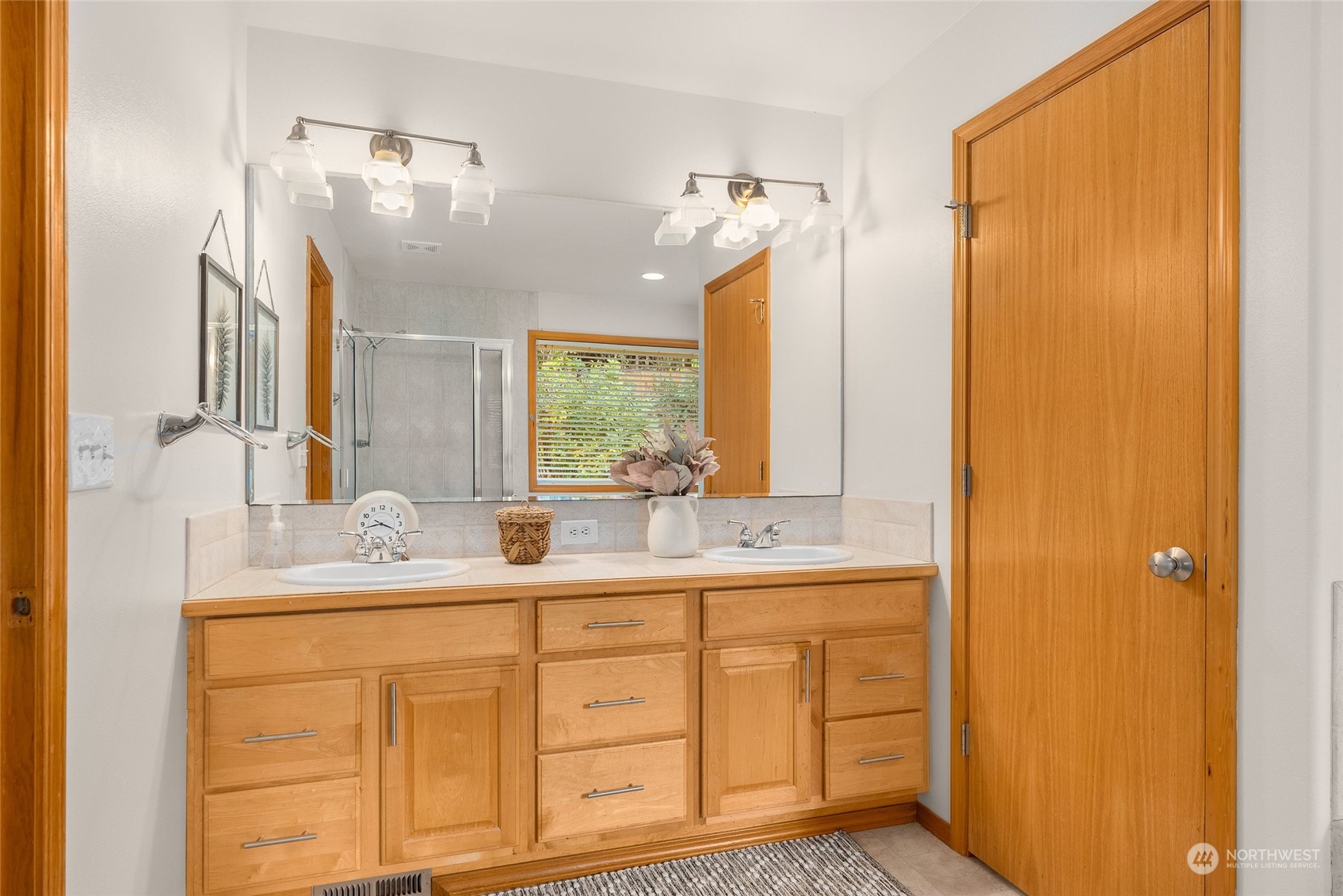 17310 Freestad Road Arlington, WA 98223 - Photo 21 of 29 a bathroom with a double vanity sink and a mirror