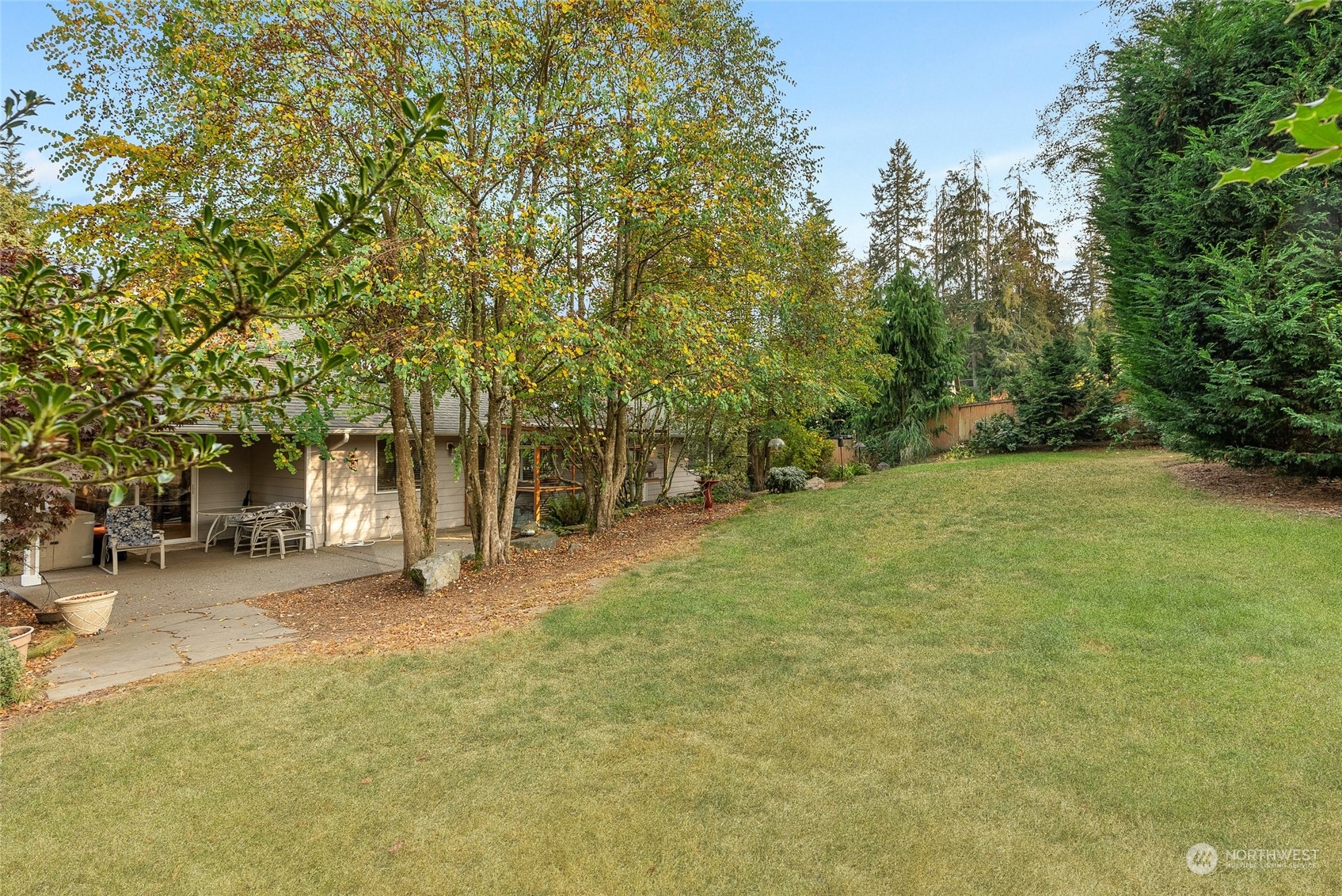 17310 Freestad Road Arlington, WA 98223 - Photo 23 of 29 a view of a yard with a house and large trees