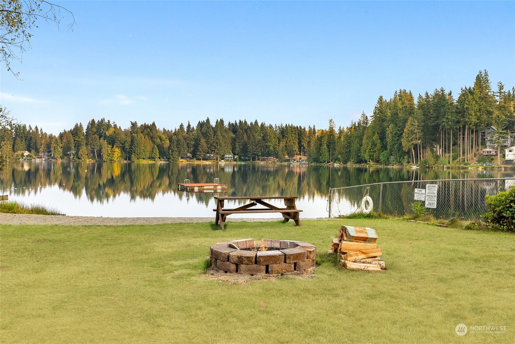 17310 Freestad Road Arlington, WA 98223 - Photo 25 of 29 a view of a lake with trees in the background
