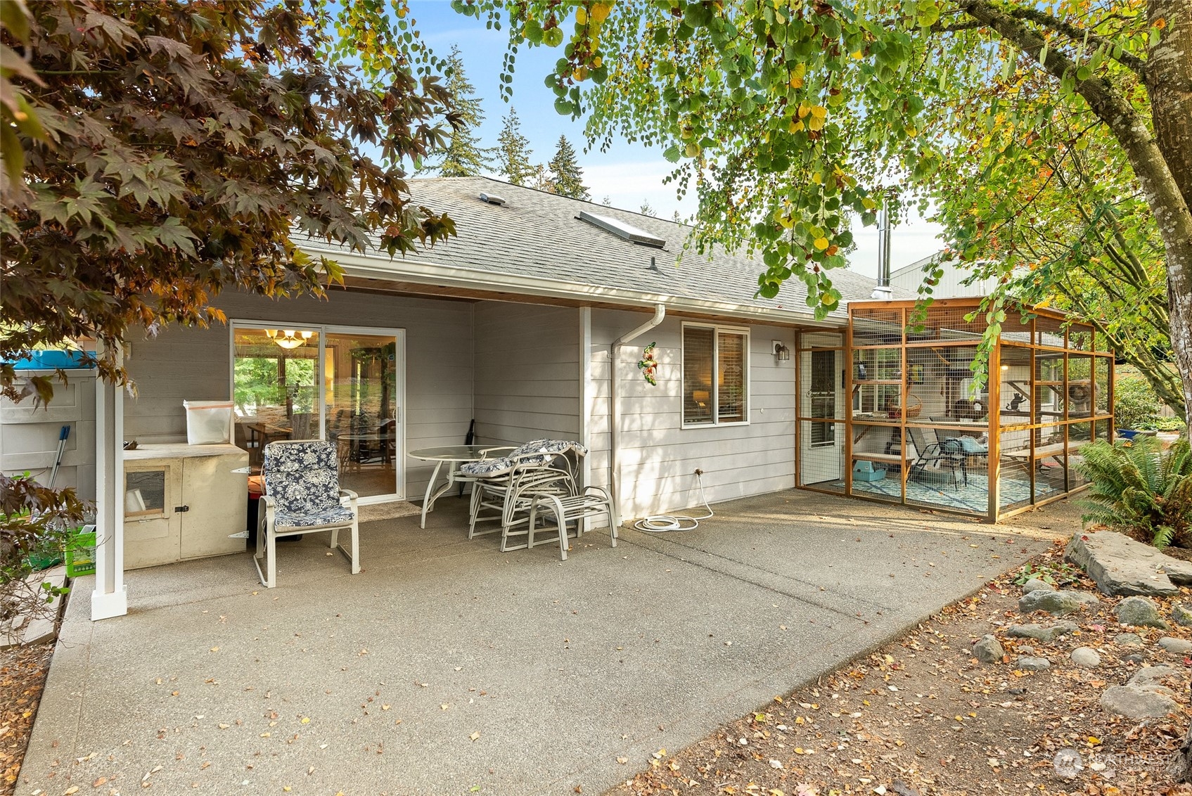 17310 Freestad Road Arlington, WA 98223 - Photo 26 of 29 a view of a house with backyard sitting area and garden