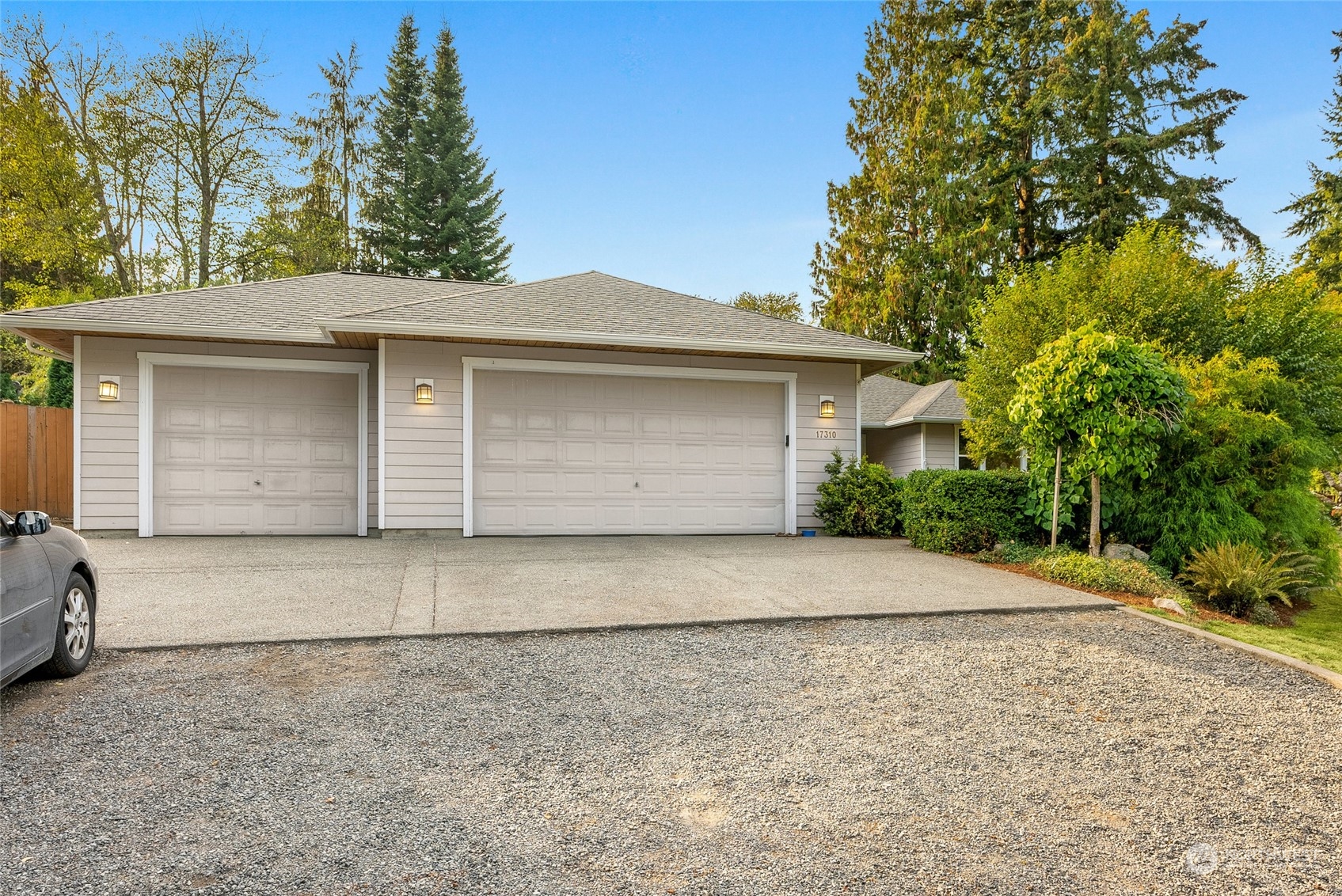 17310 Freestad Road Arlington, WA 98223 - Photo 27 of 29 a front view of a house with a yard and garage