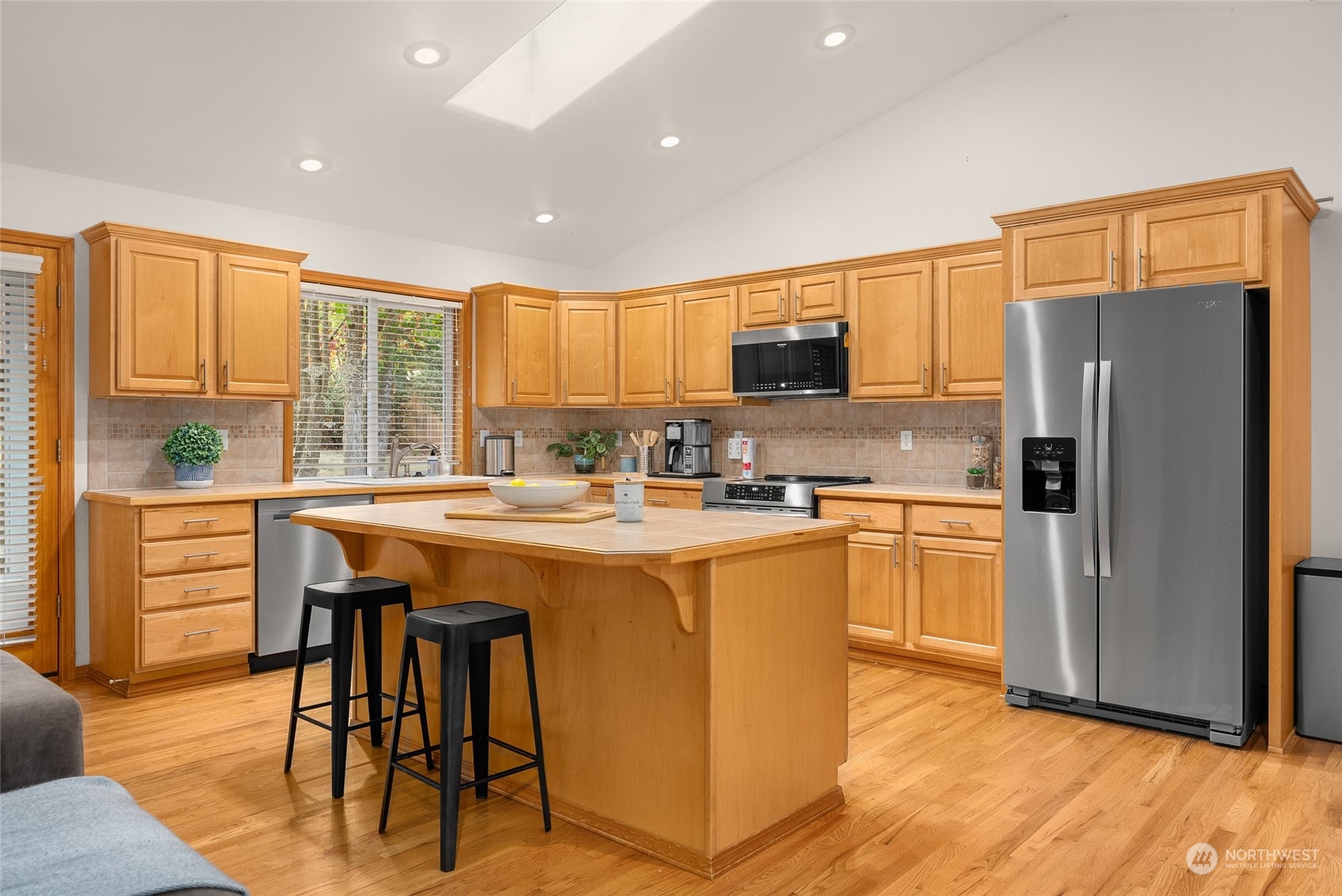 17310 Freestad Road Arlington, WA 98223 - Photo 5 of 29 a kitchen with stainless steel appliances granite countertop a stove a sink a refrigerator and a refrigerator