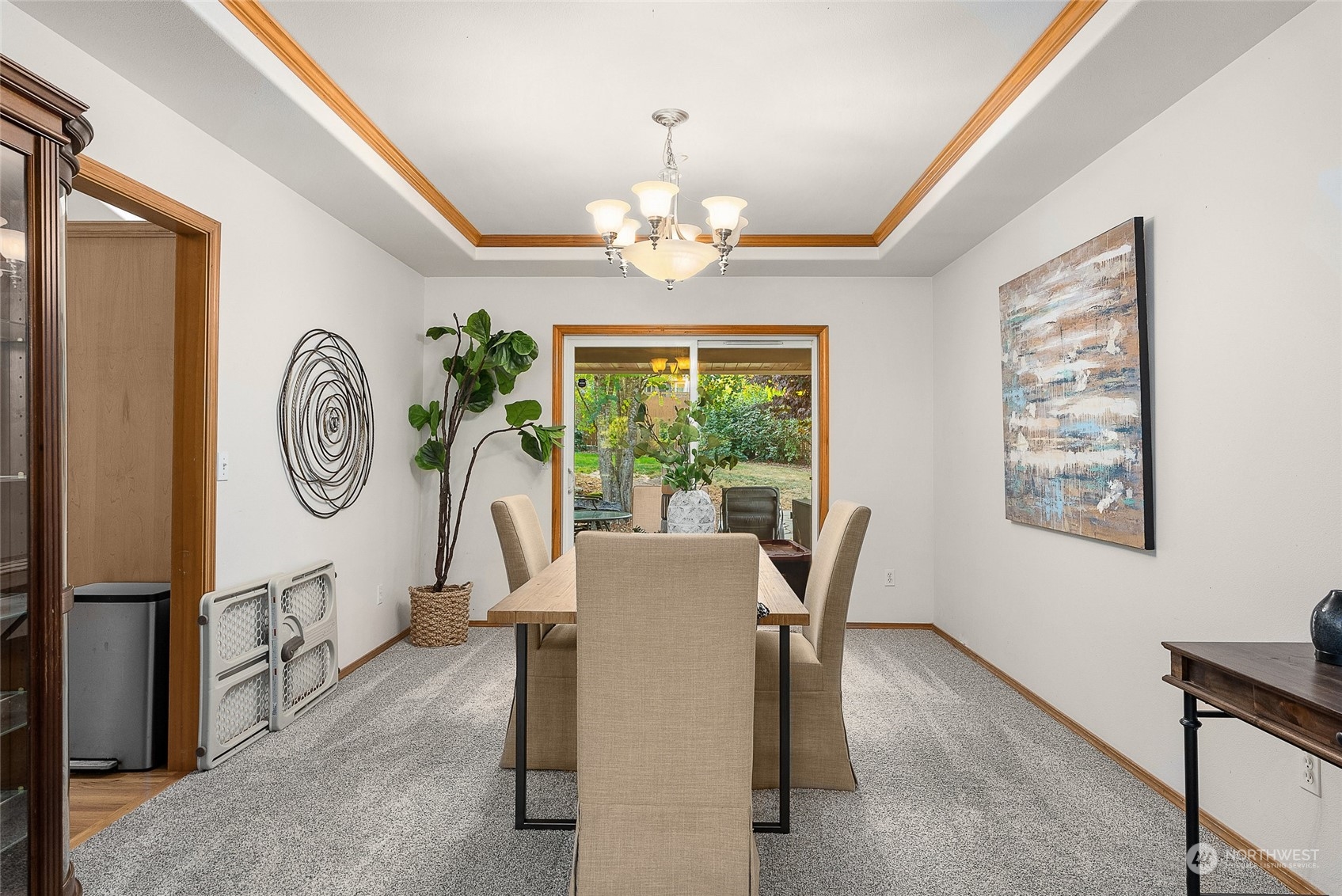 17310 Freestad Road Arlington, WA 98223 - Photo 10 of 29 a dining room with chandelier fan and wooden floor