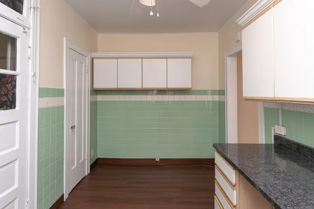 a view of a kitchen cabinets and wooden floor