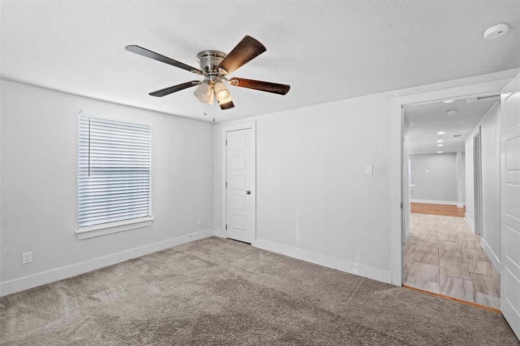 3514 Larry Street Rowlett, TX 75088 - Photo 19 of 27 a view of an empty room with a window