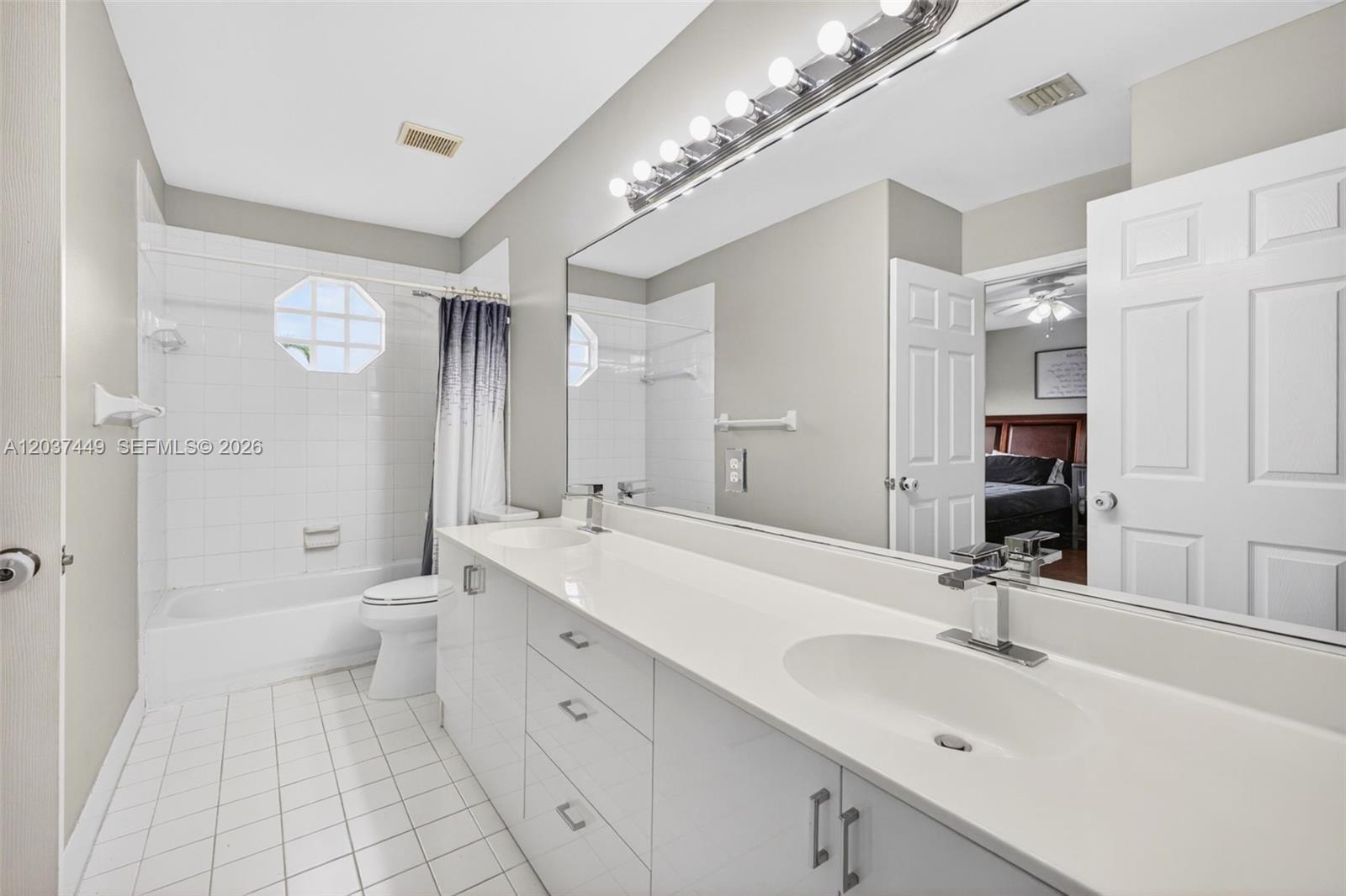 17488 Southwest 28th Court Miramar, FL 33029 - Photo 31 of 50 a spacious bathroom with a double vanity sink mirror double and shower