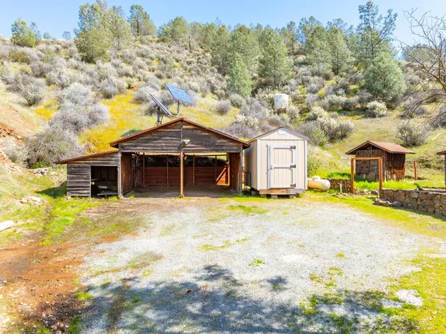 a view of backyard with cabin