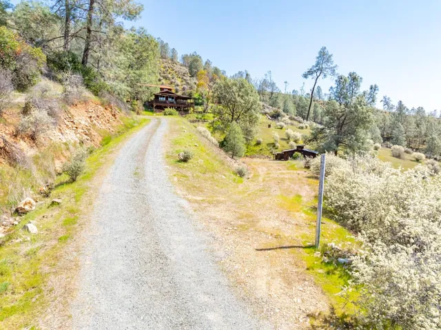 a front view of house with yard outdoor seating and patio