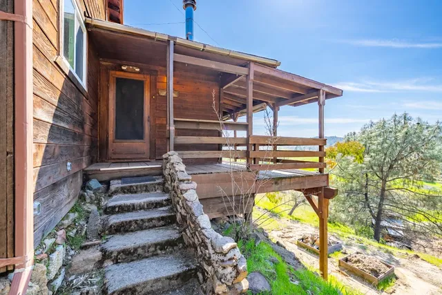 a kitchen with stainless steel appliances granite countertop a stove a sink dishwasher and cabinets with wooden floor