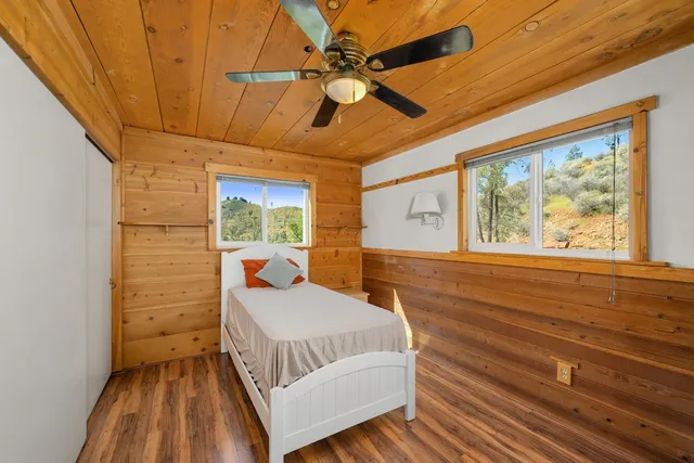 a view of a lush green hillside and houses