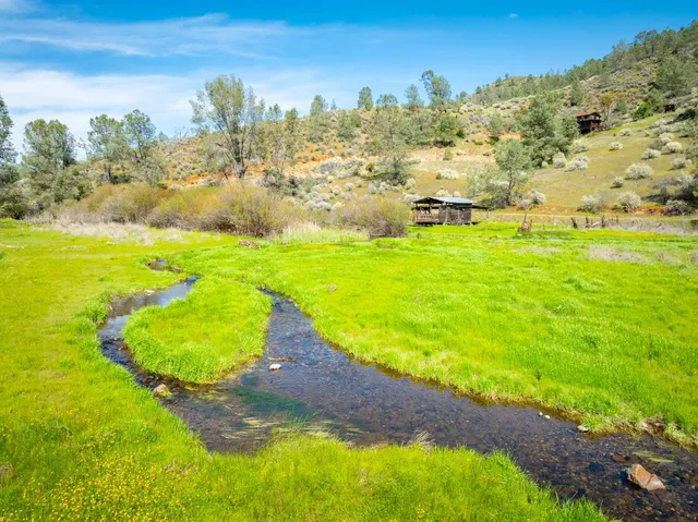 a view of a lake with a big yard