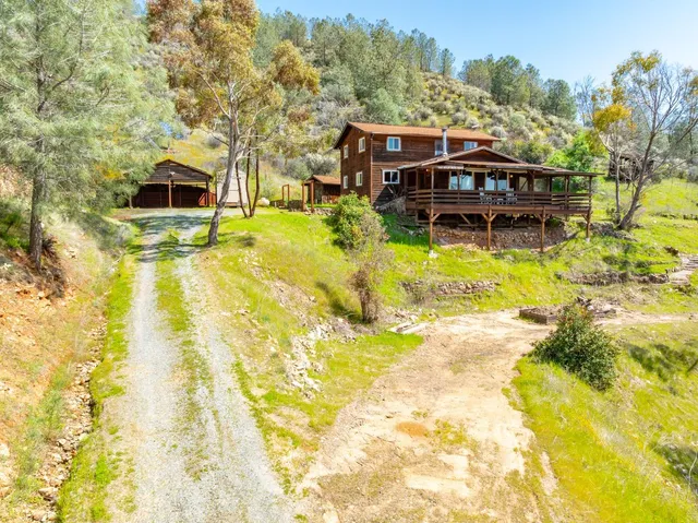 a view of pool with large trees