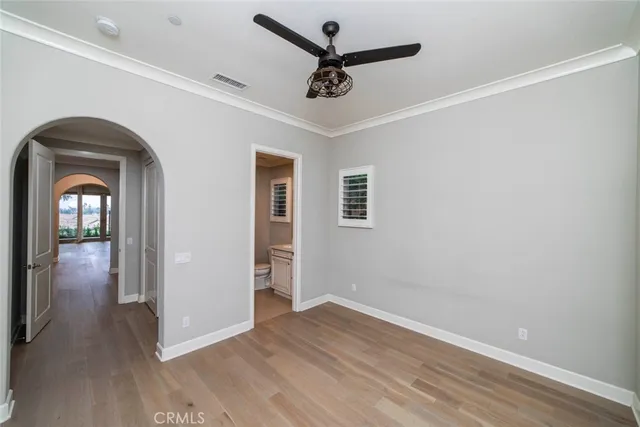 a view of livingroom with hardwood floor and a ceiling fan