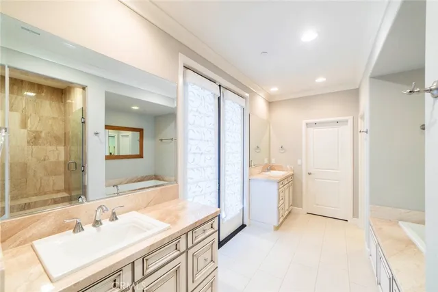 a spacious bathroom with a bathtub shower sink and toilet