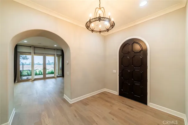 a view of a livingroom with wooden floor and window