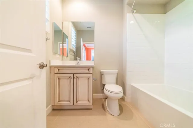 a bathroom with a toilet and a sink