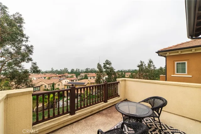 a view of a chairs and table in the balcony