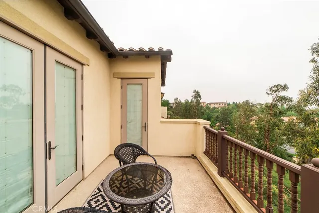 a view of a balcony with furniture