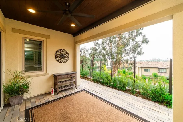 a view of a room with a window and ceiling fan