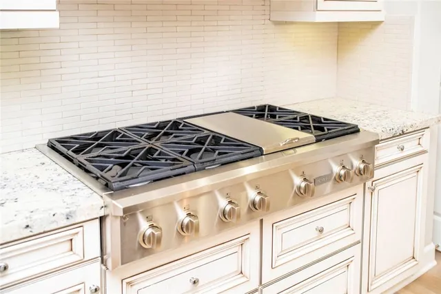 a kitchen with a sink and a refrigerator