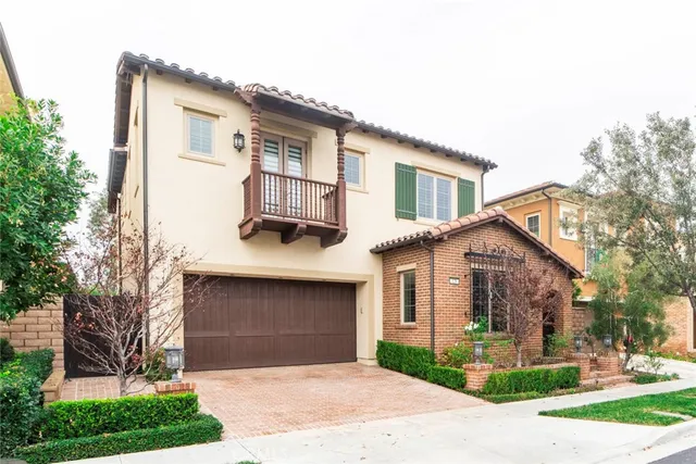 a view of a house with yard and sitting area