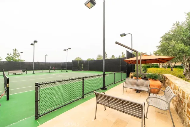 a view of a road with a house in the background