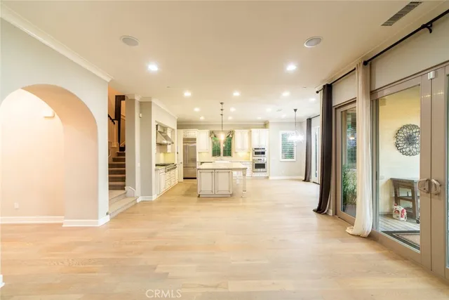 a view of a livingroom with a furniture and a kitchen