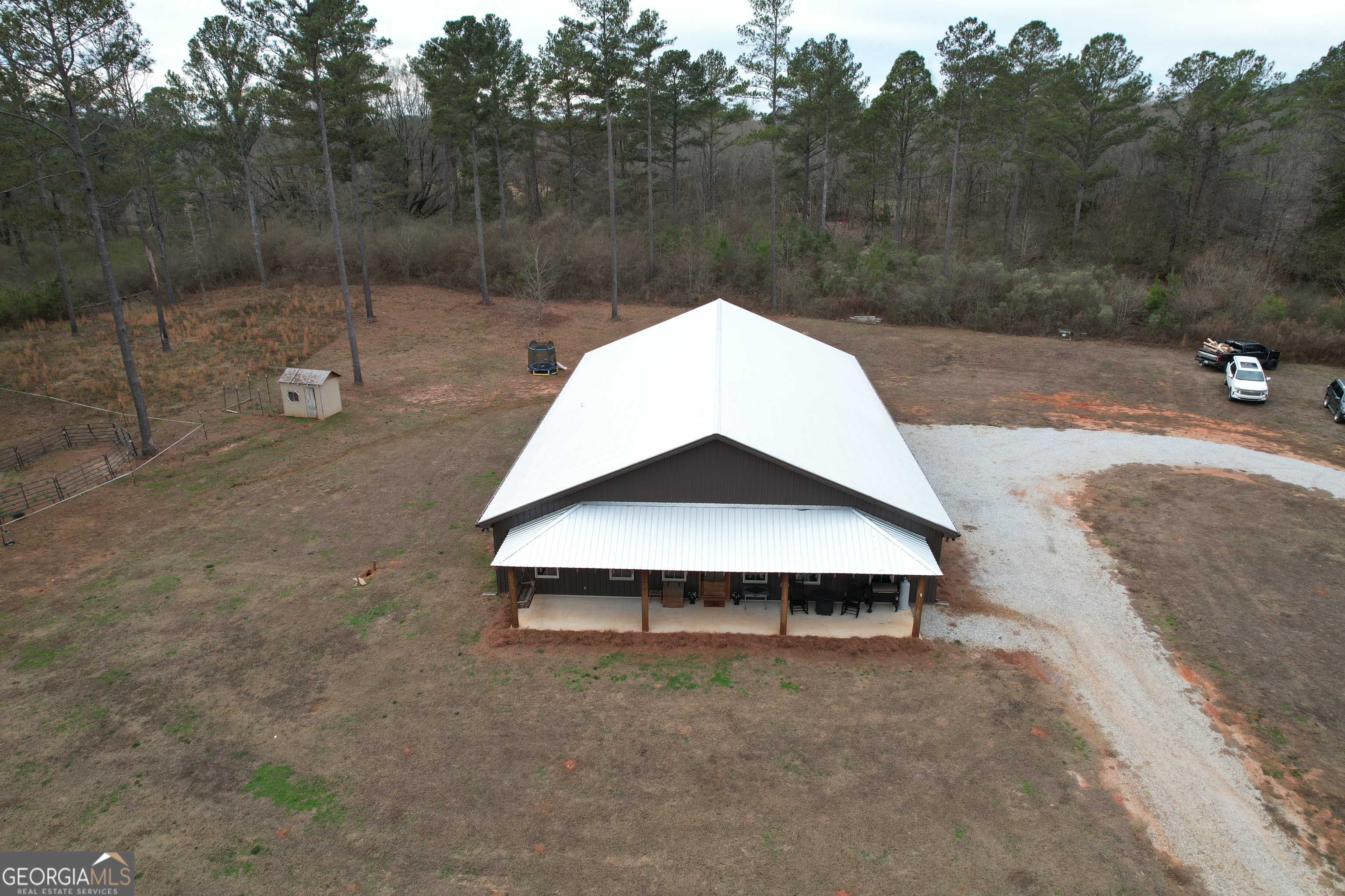 580-i B I B Howard Road Williamson, GA 30292 - Photo 106 of 123 a view of a small house with a yard and backyard