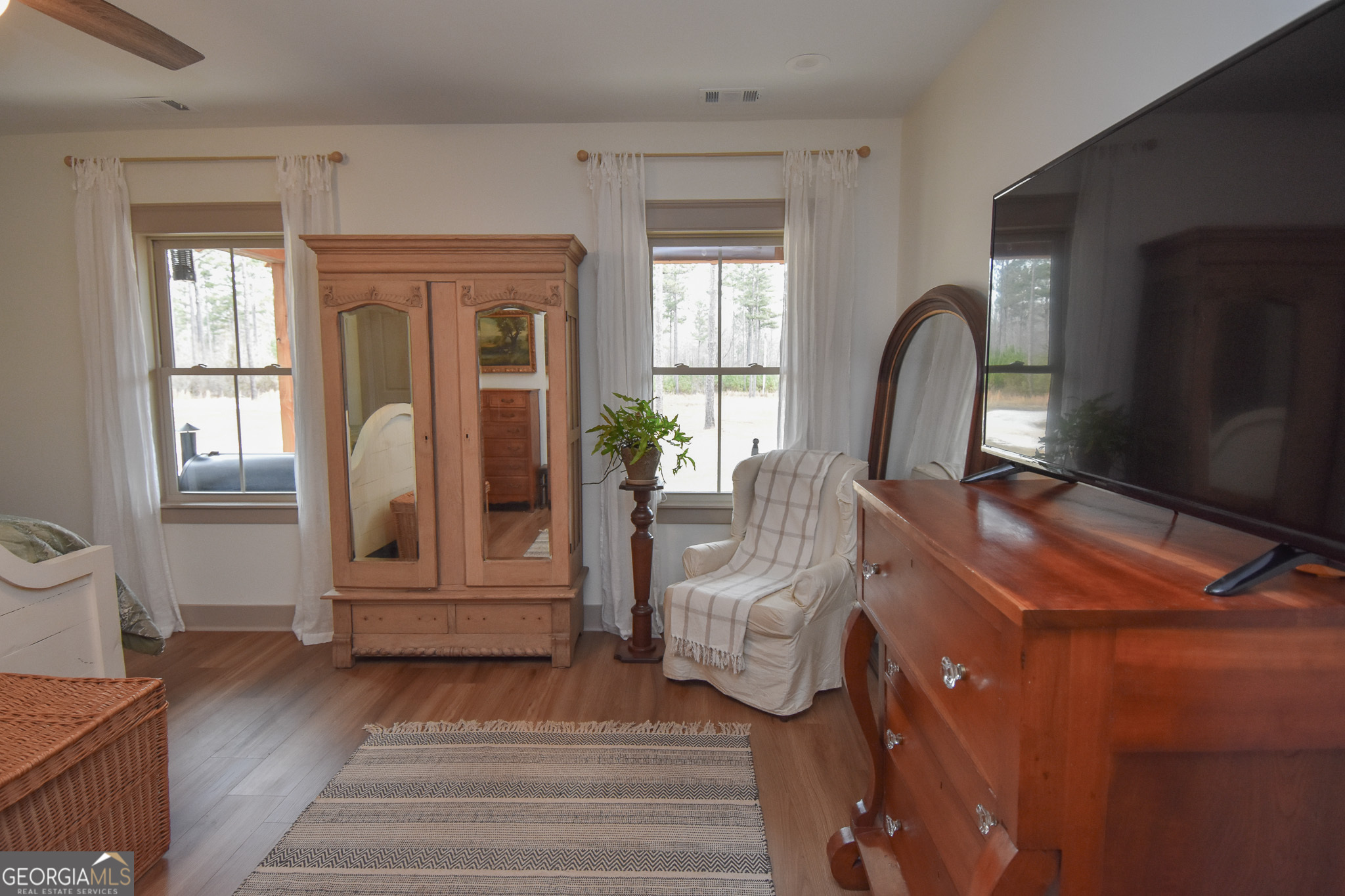 580-i B I B Howard Road Williamson, GA 30292 - Photo 45 of 123 a living room with furniture a wooden floor and a fireplace