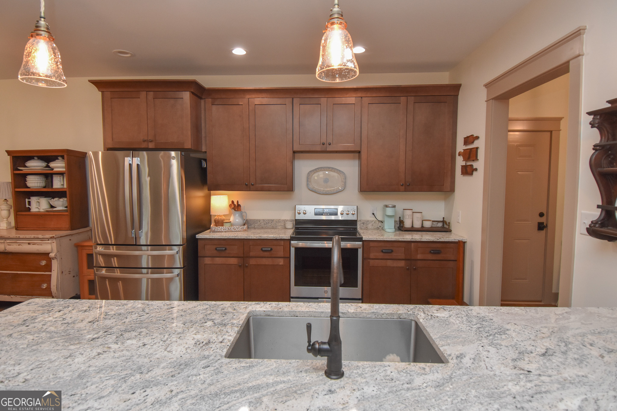 580-i B I B Howard Road Williamson, GA 30292 - Photo 51 of 123 a kitchen with stainless steel appliances granite countertop a refrigerator stove and oven