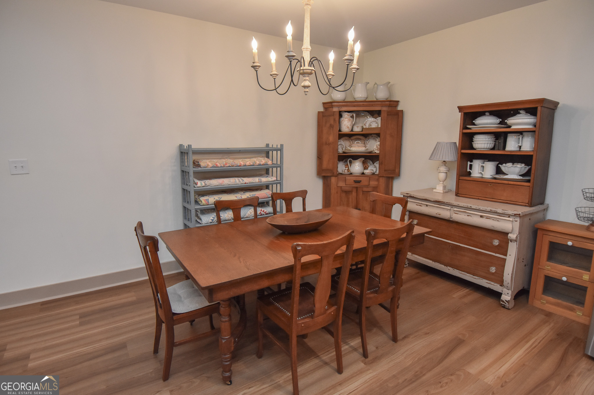 580-i B I B Howard Road Williamson, GA 30292 - Photo 54 of 123 a view of a dining room with furniture chandelier and wooden floor
