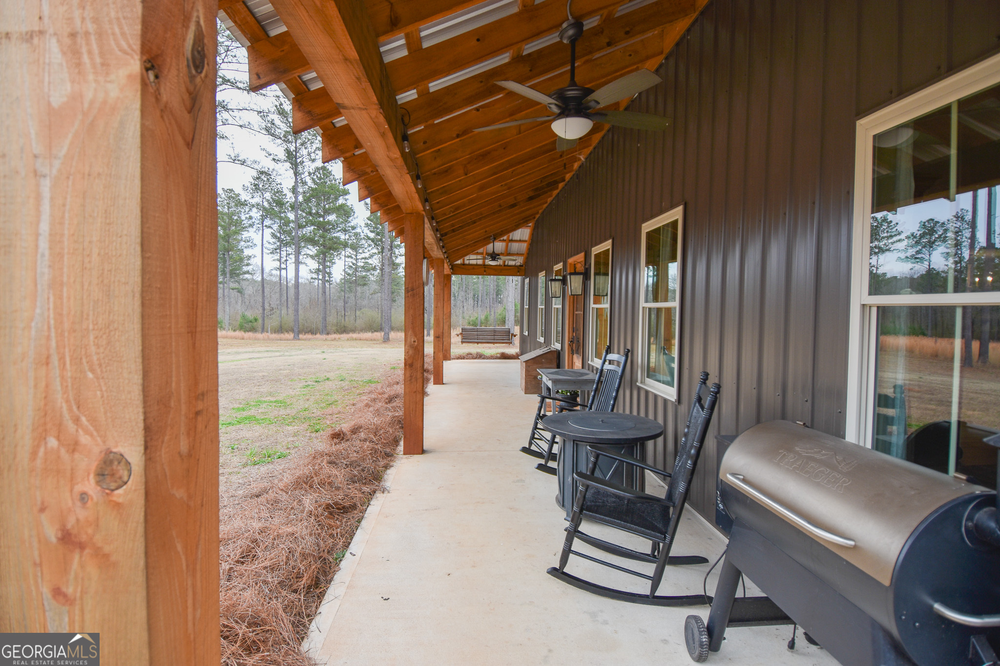 580-i B I B Howard Road Williamson, GA 30292 - Photo 64 of 123 a view of a porch with chairs and backyard